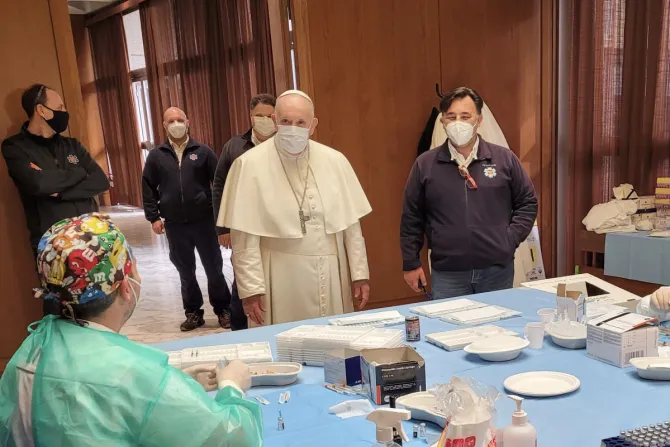 Pope Francis greets medical workers administering the vaccine against COVID-19 April 2, 2021.